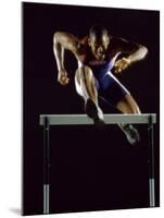 Portrait of a Young Man Jumping over a Hurdle-null-Mounted Photographic Print