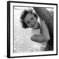 Portrait of American Actress Debbie Reynolds as She Poses Behind a Tree, 1950-Loomis Dean-Framed Photographic Print