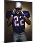 Portrait of an American Football Player Removing His Helmet-null-Mounted Photographic Print