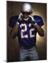 Portrait of an American Football Player Removing His Helmet-null-Mounted Photographic Print