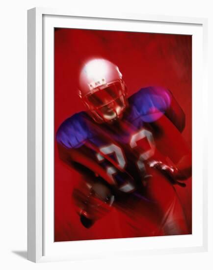 Portrait of an American Football Player Standing in a Tackle Pose-null-Framed Premium Photographic Print