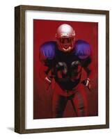 Portrait of an American Football Player Standing in a Tackle Pose-null-Framed Photographic Print