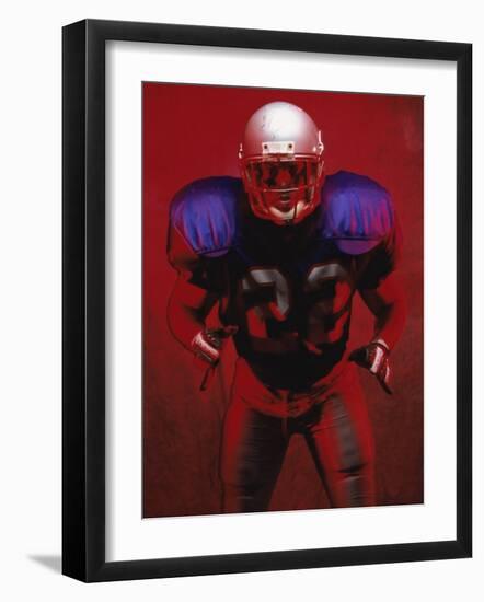 Portrait of an American Football Player Standing in a Tackle Pose-null-Framed Photographic Print