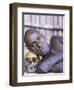 Portrait of an Asmat Tribesman Leaning on a Human Skull, Irian Jaya, Indonesia-Claire Leimbach-Framed Photographic Print