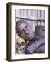 Portrait of an Asmat Tribesman Leaning on a Human Skull, Irian Jaya, Indonesia-Claire Leimbach-Framed Photographic Print