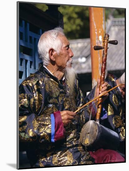 Portrait of an Elderly Musician from the Naxi Orchestra Practising by the Black Dragon Pool, China-Doug Traverso-Mounted Photographic Print