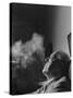 Portrait of Architect Mies Van Der Rohe Exhaling Smoke-Frank Scherschel-Stretched Canvas
