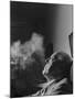 Portrait of Architect Mies Van Der Rohe Exhaling Smoke-Frank Scherschel-Mounted Premium Photographic Print