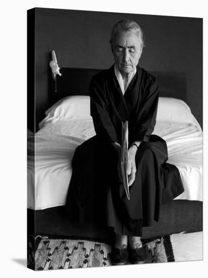 Portrait of Artist Georgia O'Keeffe Holding a Book by Leonard Baskinin Her Bedroom-John Loengard-Stretched Canvas