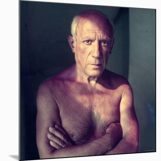 Portrait of Artist Pablo Picasso, Arms Folded Across Bare Chest, at His Home, Alone-Gjon Mili-Mounted Premium Photographic Print