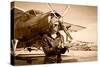 Portrait of Beautiful Female Pilot with Plane Behind. Sepia Photo.-Aleksandar Todorovic-Stretched Canvas