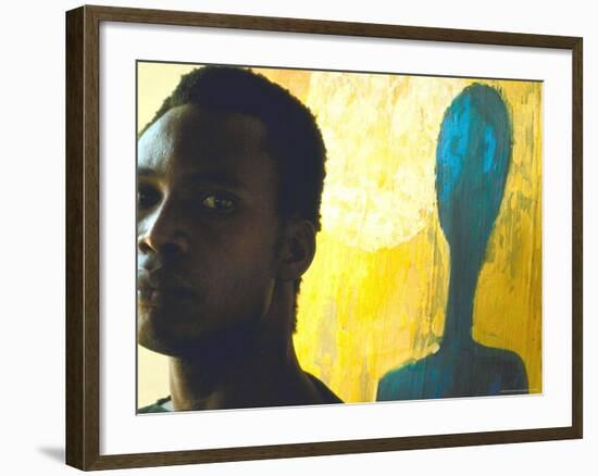 Portrait of Nigerian Artist Erhabor Emokpae Standing Next to One of His Colorful Paintings-Carlo Bavagnoli-Framed Premium Photographic Print