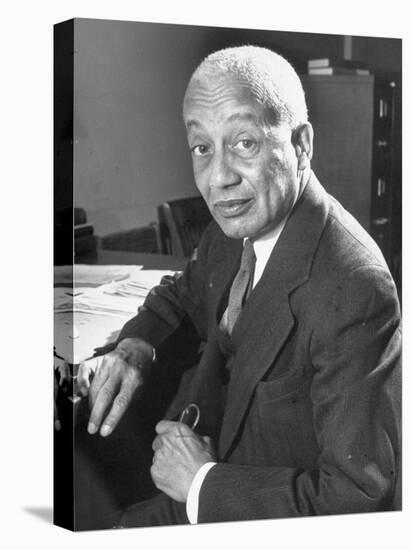 Portrait of Philosopher Alain Leroy Locke Sitting at Desk in Office at Howard University-Alfred Eisenstaedt-Stretched Canvas