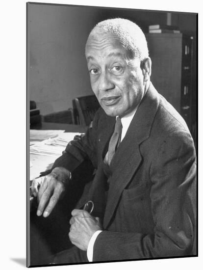 Portrait of Philosopher Alain Leroy Locke Sitting at Desk in Office at Howard University-Alfred Eisenstaedt-Mounted Photographic Print