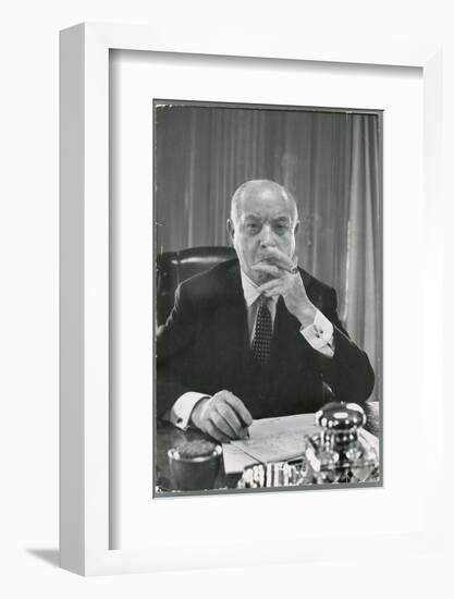 Portrait of RCA Chairman David Sarnoff Sitting at Desk in His Office, Smoking a Cigar-Alfred Eisenstaedt-Framed Photographic Print