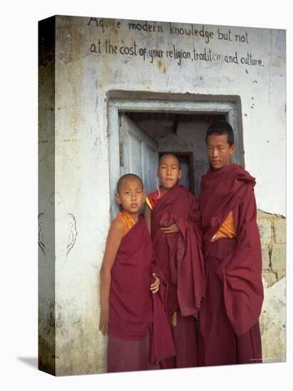 Portrait of Three Tibetan Buddhist Monks, Tashi Jong Monastery, Tibet, China-Simon Westcott-Stretched Canvas