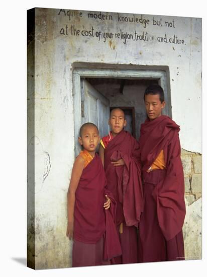 Portrait of Three Tibetan Buddhist Monks, Tashi Jong Monastery, Tibet, China-Simon Westcott-Stretched Canvas