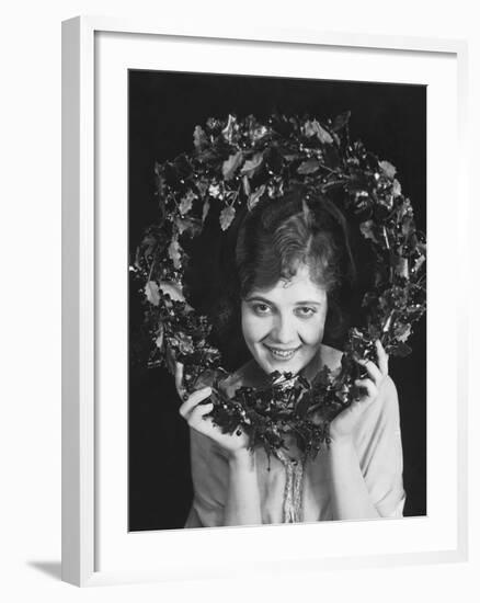 Portrait of Woman Holding Christmas Wreath-null-Framed Photo