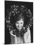 Portrait of Woman Holding Christmas Wreath-null-Mounted Photo