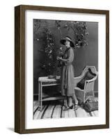 Portrait of Woman Indoors Holding Tennis Racket-null-Framed Photo