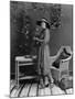 Portrait of Woman Indoors Holding Tennis Racket-null-Mounted Photo