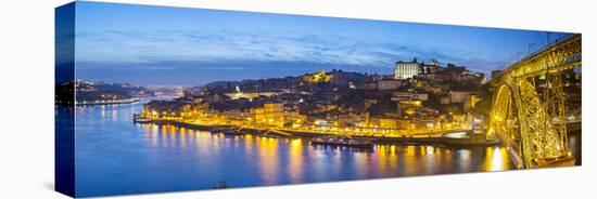 Portugal, Douro Litoral, Porto. Dusk in the UNESCO listed Ribeira district.-Nick Ledger-Stretched Canvas