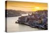 Portugal, Douro Litoral, Porto. Sunset over the UNESCO listed Ribeira district, viewed from Dom Lui-Nick Ledger-Stretched Canvas