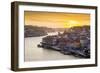 Portugal, Douro Litoral, Porto. Sunset over the UNESCO listed Ribeira district, viewed from Dom Lui-Nick Ledger-Framed Photographic Print