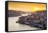 Portugal, Douro Litoral, Porto. Sunset over the UNESCO listed Ribeira district, viewed from Dom Lui-Nick Ledger-Framed Stretched Canvas