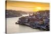 Portugal, Douro Litoral, Porto. Sunset over the UNESCO listed Ribeira district, viewed from Dom Lui-Nick Ledger-Stretched Canvas