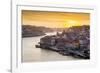 Portugal, Douro Litoral, Porto. Sunset over the UNESCO listed Ribeira district, viewed from Dom Lui-Nick Ledger-Framed Photographic Print