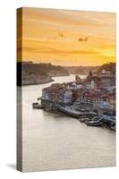 Portugal, Douro Litoral, Porto. Sunset over the UNESCO listed Ribeira district, viewed from Dom Lui-Nick Ledger-Stretched Canvas