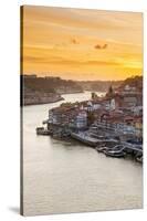 Portugal, Douro Litoral, Porto. Sunset over the UNESCO listed Ribeira district, viewed from Dom Lui-Nick Ledger-Stretched Canvas