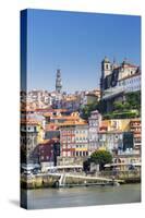 Portugal, Douro Litoral, Porto. The view across the Douro River to the UNESCO listed Old Town of Po-Nick Ledger-Stretched Canvas