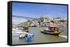 Portugal, Douro Litoral, Porto. Tourists boats on Douro River in the UNESCO listed Ribeira district-Nick Ledger-Framed Stretched Canvas