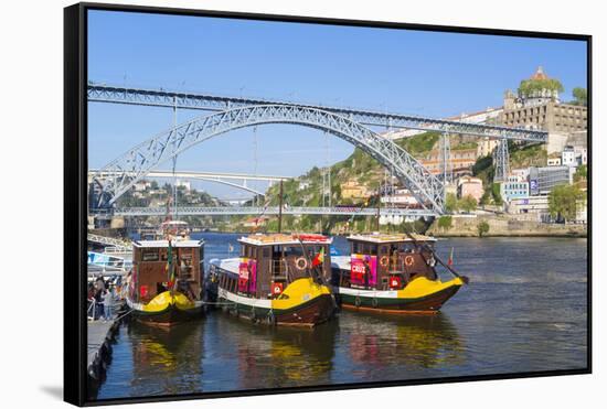 Portugal, Douro Litoral, Porto. Tourists boats on Douro River in the UNESCO listed Ribeira district-Nick Ledger-Framed Stretched Canvas