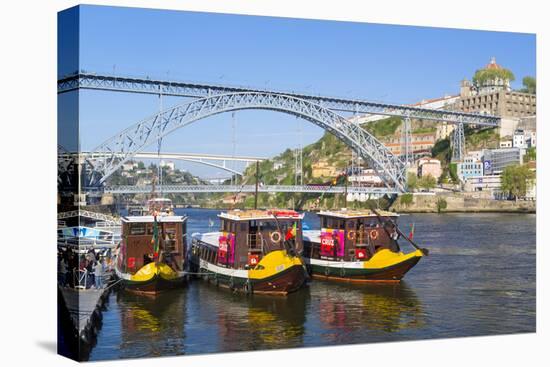 Portugal, Douro Litoral, Porto. Tourists boats on Douro River in the UNESCO listed Ribeira district-Nick Ledger-Stretched Canvas