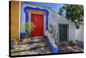 Portugal, Obidos, Bright Red Door of Colored Homes Inside the Walled City-Terry Eggers-Stretched Canvas