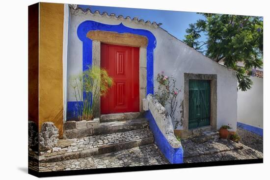 Portugal, Obidos, Bright Red Door of Colored Homes Inside the Walled City-Terry Eggers-Stretched Canvas