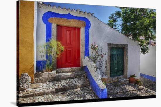 Portugal, Obidos, Bright Red Door of Colored Homes Inside the Walled City-Terry Eggers-Stretched Canvas