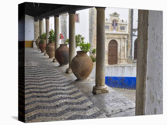 Portugal, Obidos. Ceramic pots adorning a building ledge.-Terry Eggers-Stretched Canvas