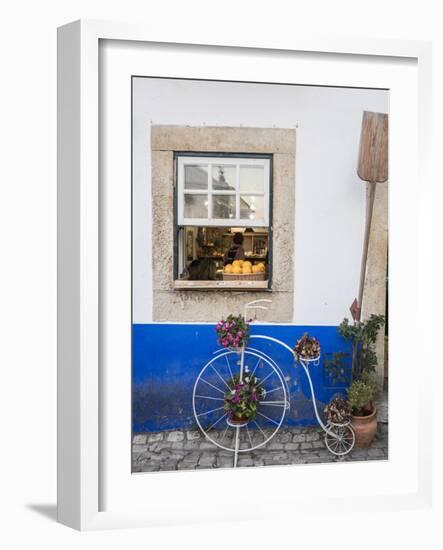 Portugal, Obidos. Cute bicycle planter in front of a bakery in the walled city of Obidos.-Julie Eggers-Framed Photographic Print