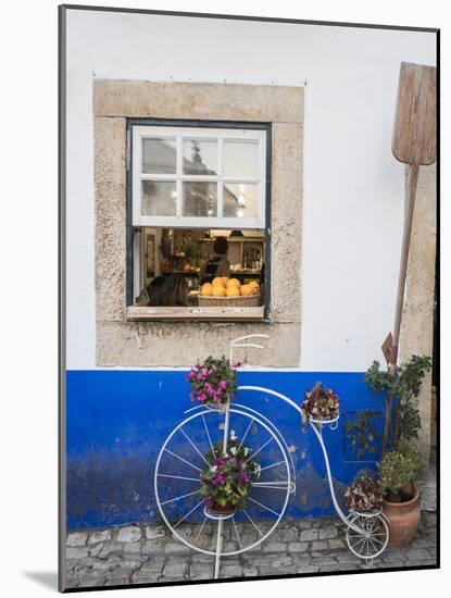 Portugal, Obidos. Cute bicycle planter in front of a bakery in the walled city of Obidos.-Julie Eggers-Mounted Photographic Print