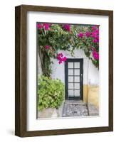 Portugal, Obidos. Doorway surrounded by a bougainvillea vine.-Julie Eggers-Framed Photographic Print