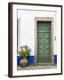 Portugal, Obidos. Pink hydrangea in terracotta pot next to a green door.-Julie Eggers-Framed Photographic Print