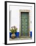 Portugal, Obidos. Pink hydrangea in terracotta pot next to a green door.-Julie Eggers-Framed Photographic Print