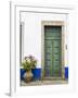 Portugal, Obidos. Pink hydrangea in terracotta pot next to a green door.-Julie Eggers-Framed Photographic Print