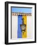 Portugal, Obidos. Wrought iron lantern hanging from a colorful stripped wall in the walled town.-Julie Eggers-Framed Photographic Print