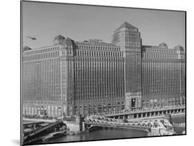 Postal Service Helicopter Nearing Merchandise Mart-null-Mounted Photographic Print