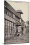 Postcard Depicting a Group of People Standing Outside a Farm Building with a Bull-null-Mounted Photographic Print